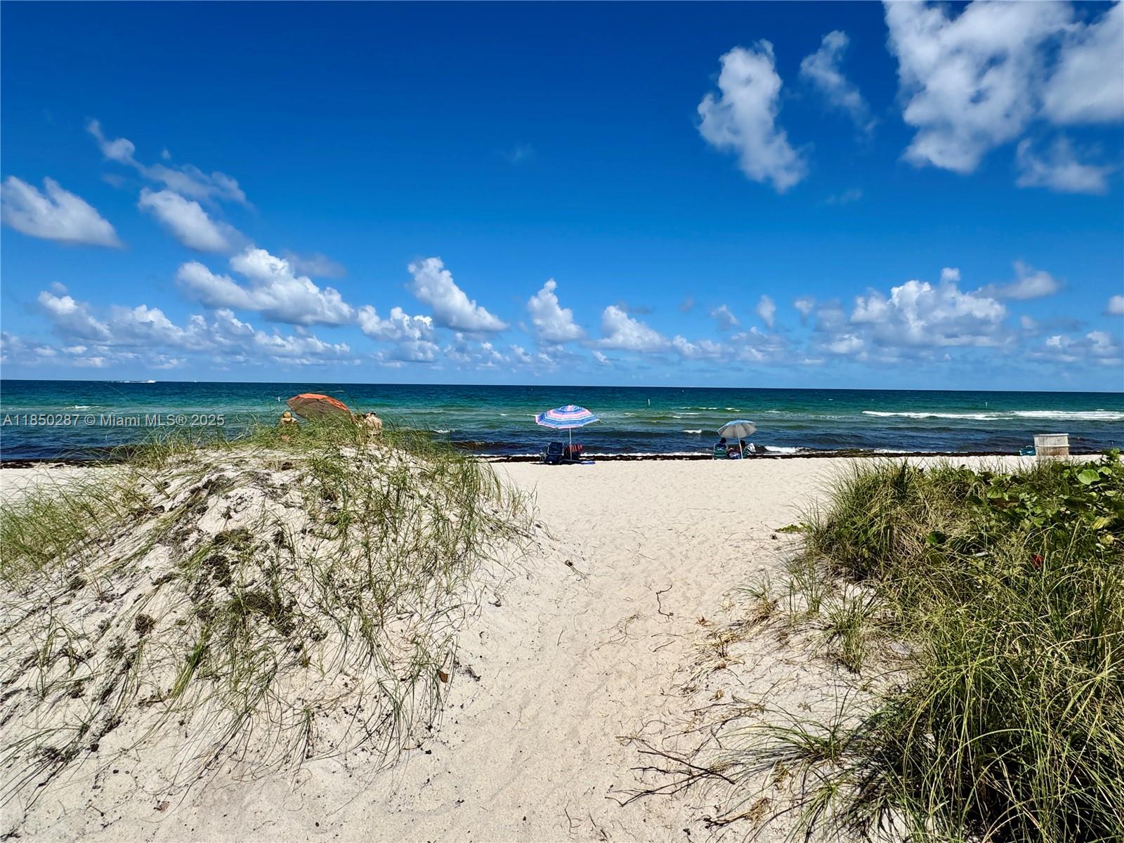 9201 Collins Avenue, Unit 323 Surfside, FL 33154 - Photo 46 of 46 a view of a lake in the backyard of a house with a lake view