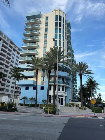 a view of ocean with a palm tree