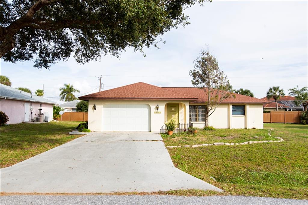 4741 Bonita Road Venice, FL 34293 - Photo 1 of 1 a front view of a house with a yard and garage