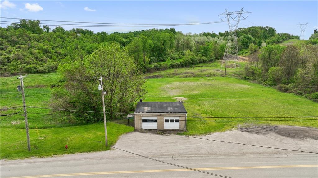 373 Searight Herbert Road Uniontown, PA 15401 - Photo 16 of 40 a backyard of a house with lots of green space
