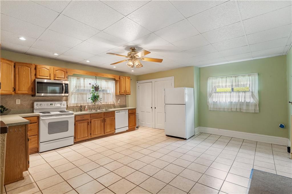 373 Searight Herbert Road Uniontown, PA 15401 - Photo 20 of 40 a kitchen with a refrigerator and microwave