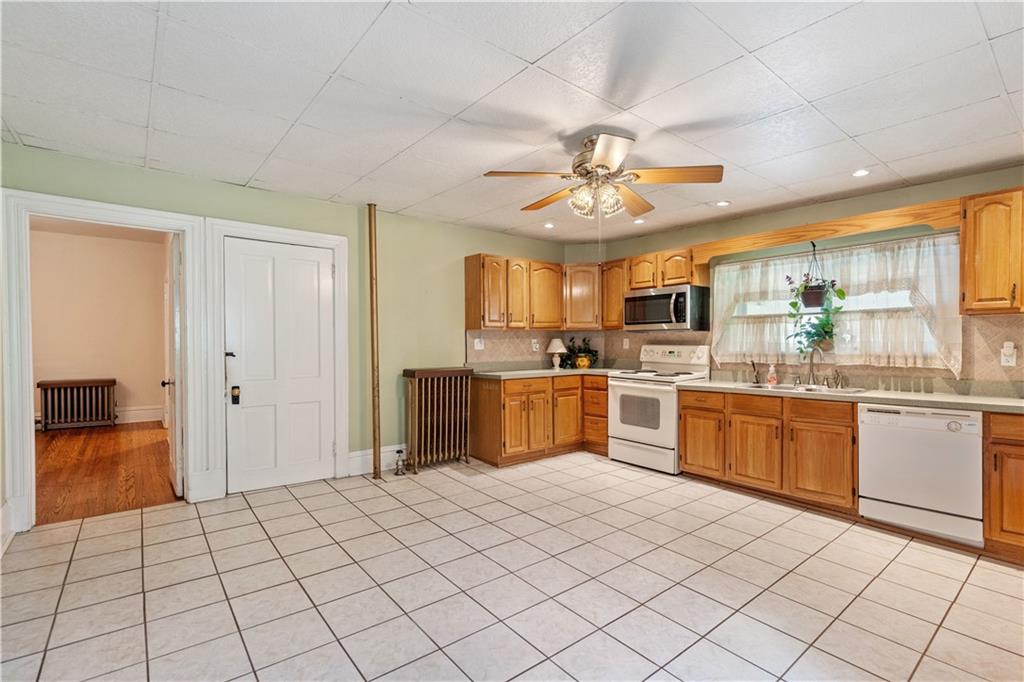 373 Searight Herbert Road Uniontown, PA 15401 - Photo 21 of 40 a kitchen with a sink cabinets and window