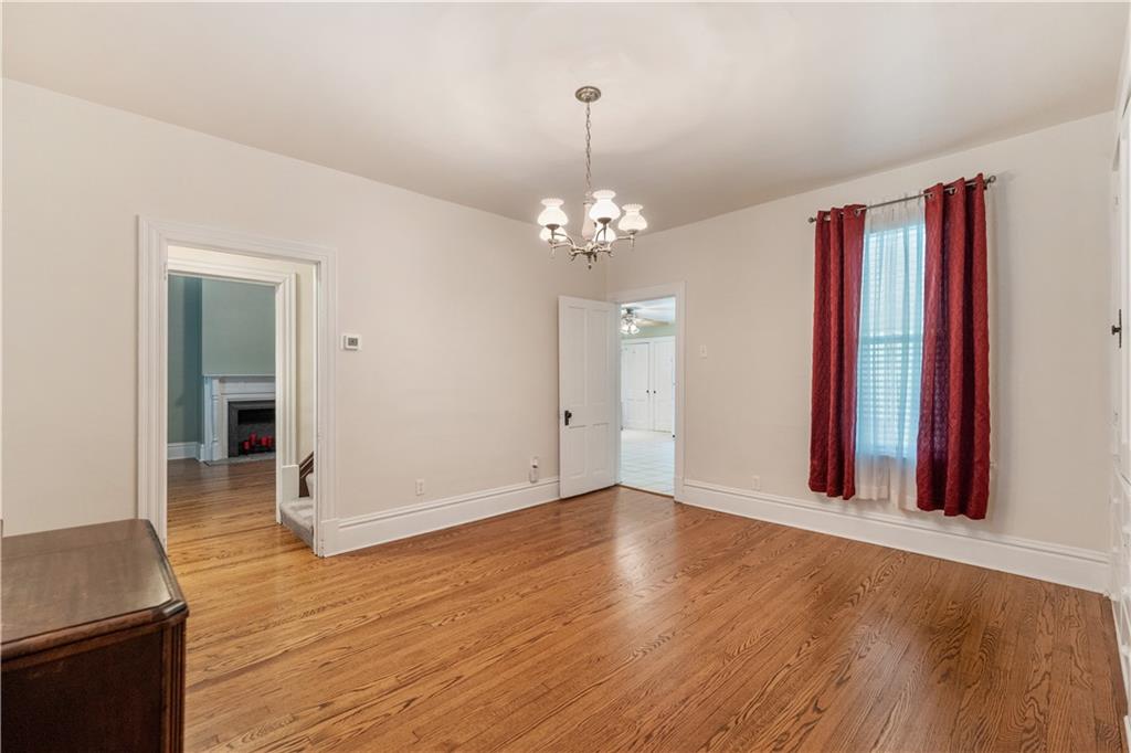 373 Searight Herbert Road Uniontown, PA 15401 - Photo 24 of 40 an empty room with wooden floor and windows