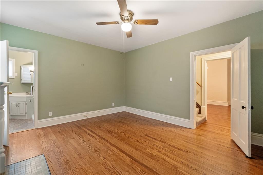 373 Searight Herbert Road Uniontown, PA 15401 - Photo 29 of 40 wooden floor in an empty room with a window