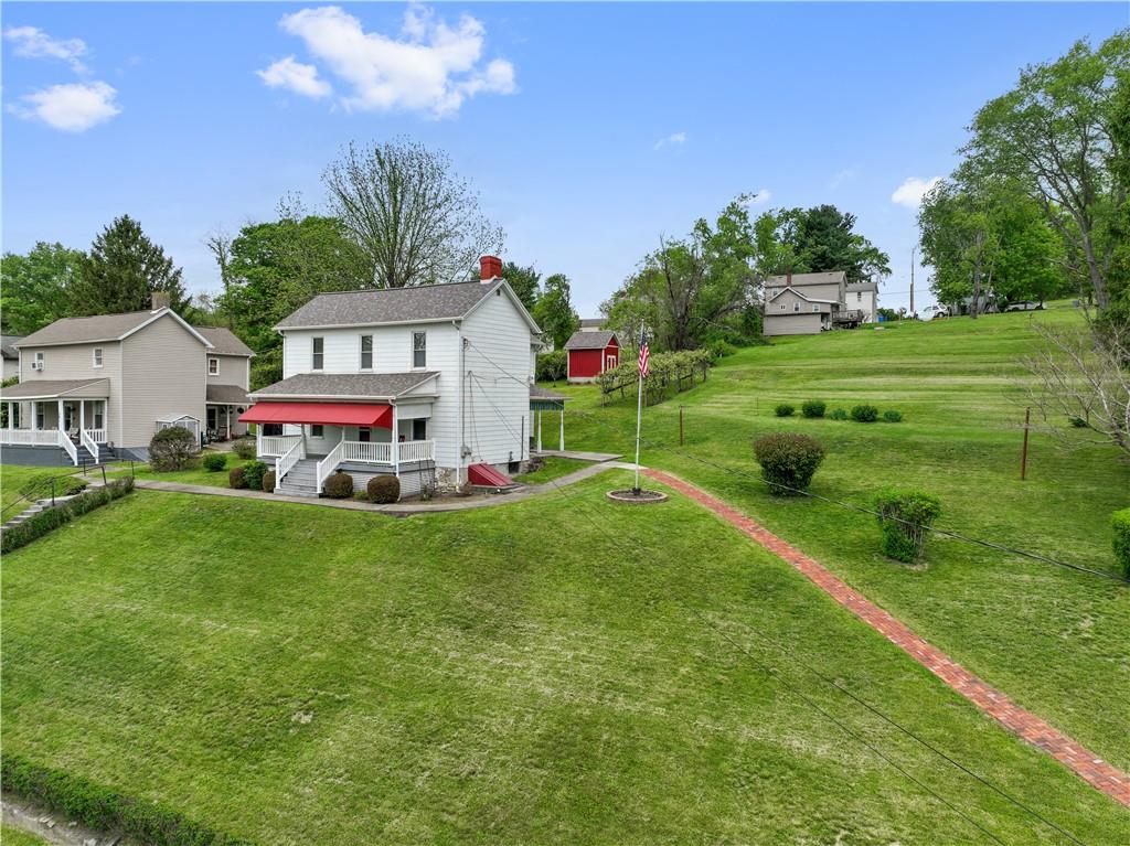 373 Searight Herbert Road Uniontown, PA 15401 - Photo 3 of 40 a front view of a house with garden