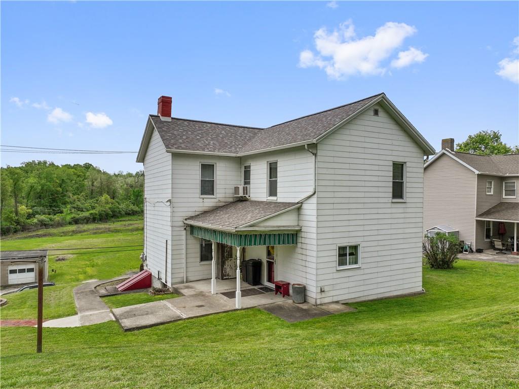 373 Searight Herbert Road Uniontown, PA 15401 - Photo 6 of 40 a view of a house with a yard porch and sitting area