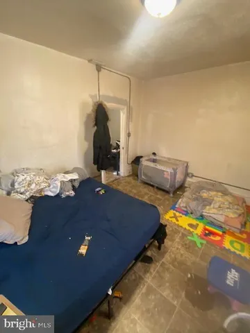 a room with water heater and wooden floor