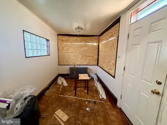 a view of an empty room with windows