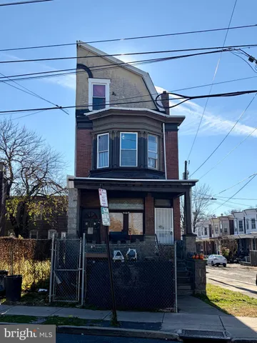 a front view of a house with parking space