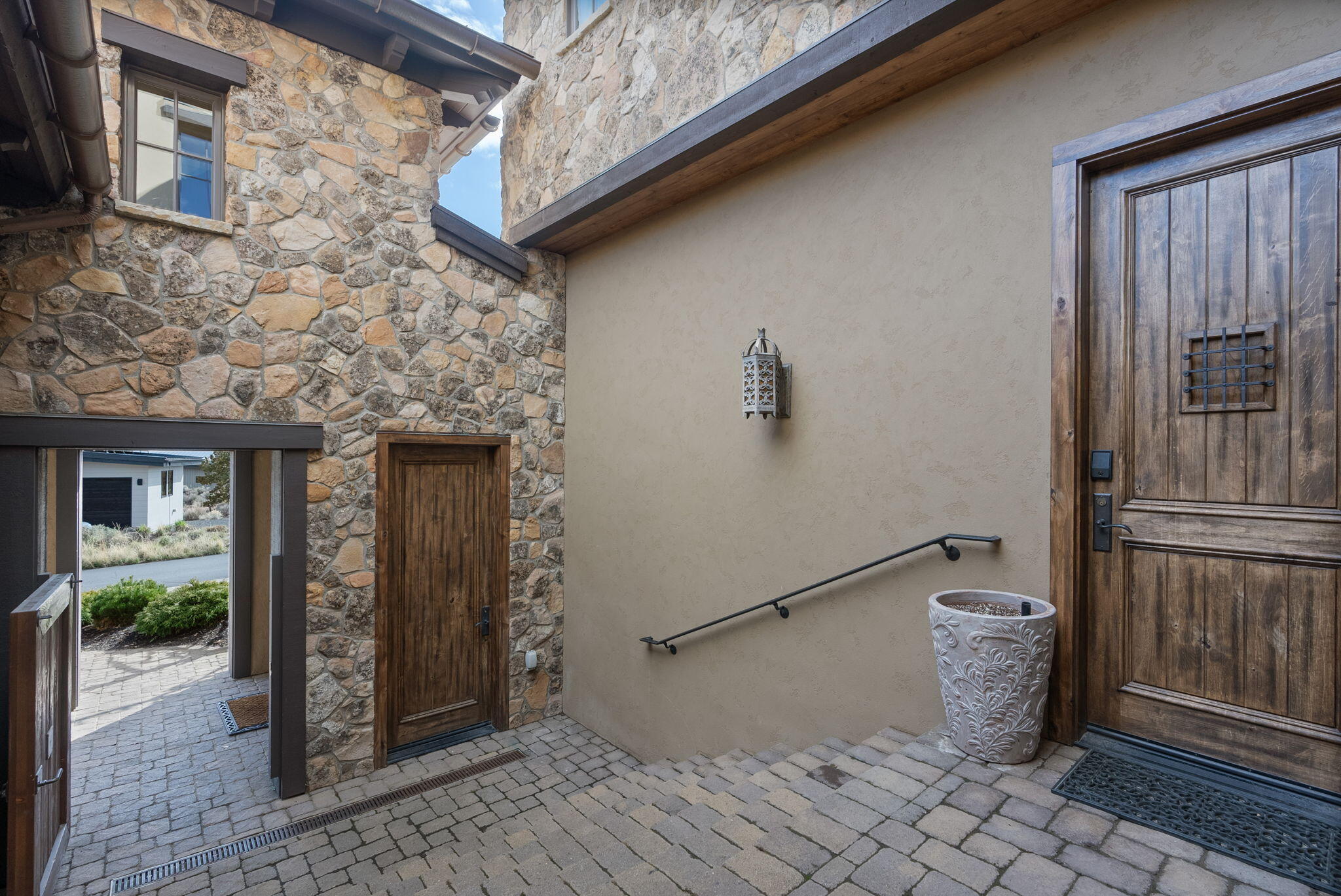 22887 Ghost Tree Lane Bend, OR 97701 - Photo 8 of 97 The timeless natural stone exterior features a welcoming courtyard
