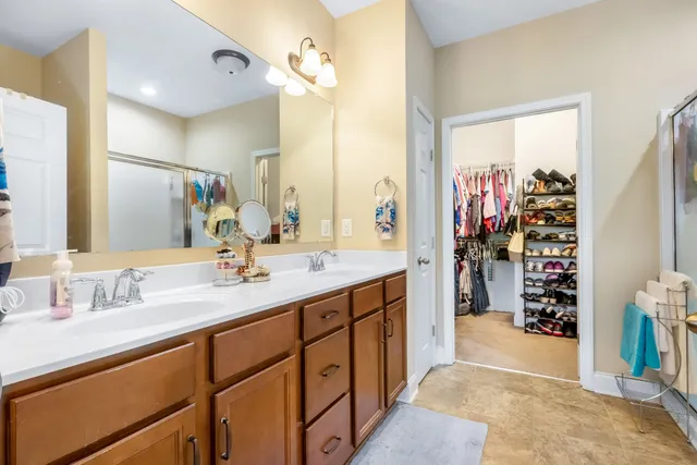 a bathroom with a sink double vanity and a mirror