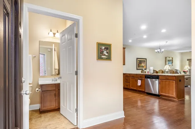 a view of a large mirror and a wooden floor