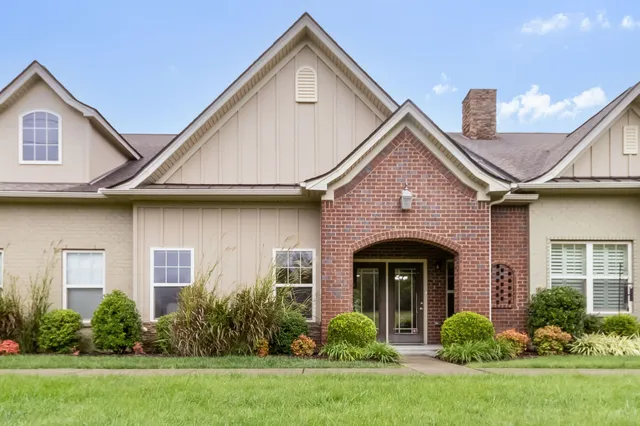 a front view of a house with garden