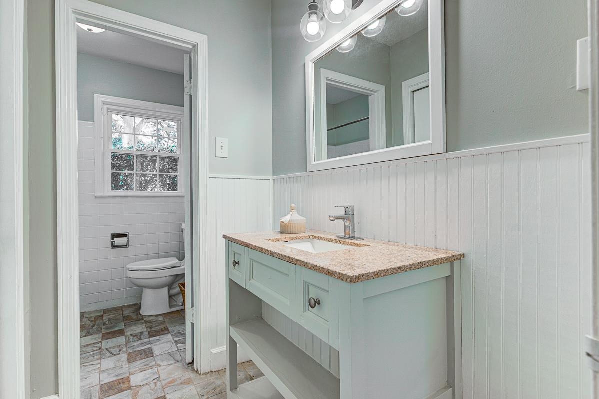 5676 Barfield Road Memphis, TN 38120 - Photo 13 of 19 Bathroom vanity featuring a granite-style countertop, undermount sink, and chrome faucet, New vanity!
