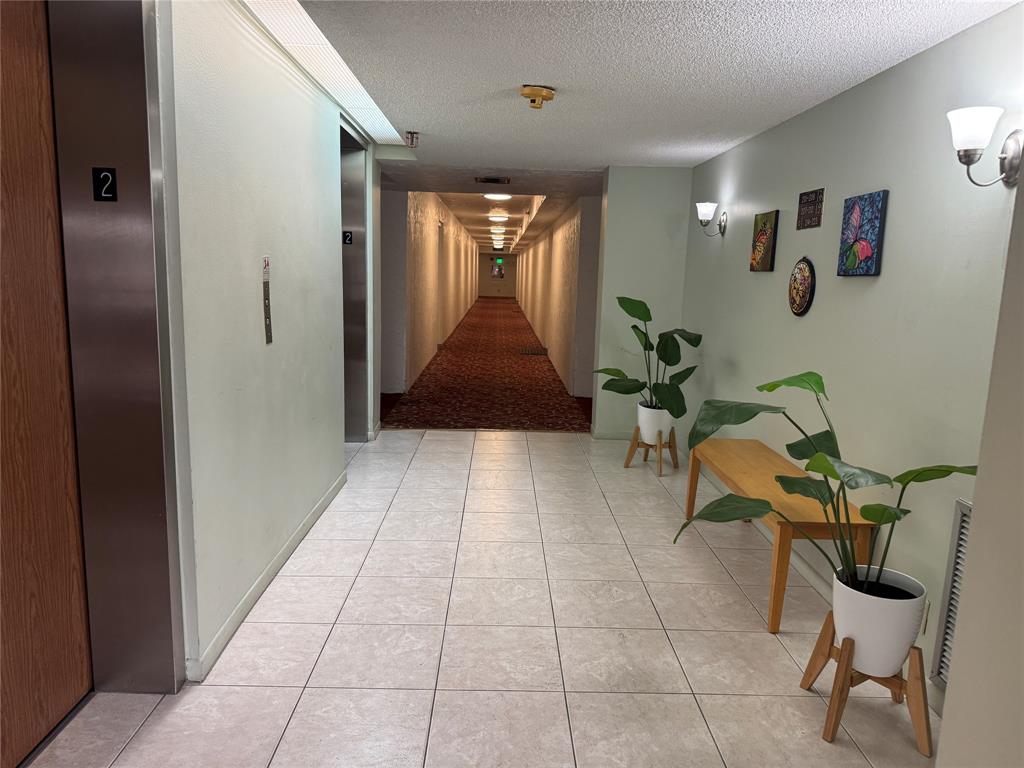 9300 Southwest 8th Street, Unit 215 Boca Raton, FL 33428 - Photo 12 of 43 INSIDE HALLWAY