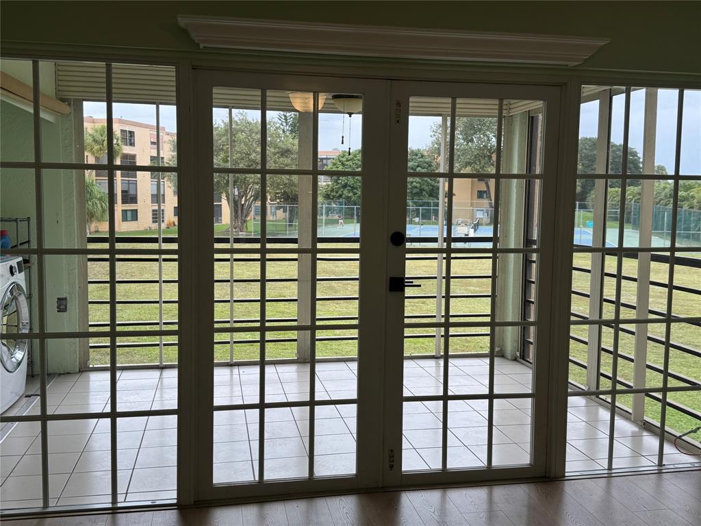 9300 Southwest 8th Street, Unit 215 Boca Raton, FL 33428 - Photo 16 of 43 FRENCH DOORS TO PATIO