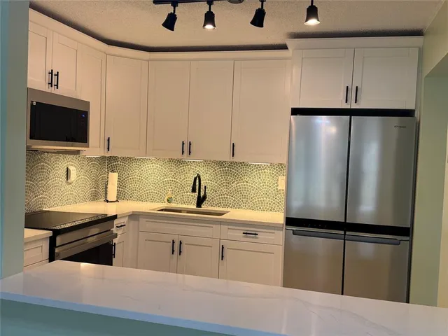 a white toilet sitting next to a small bathroom