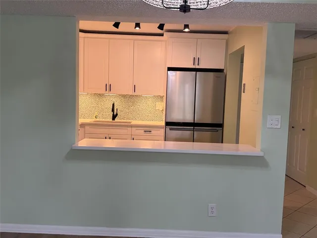 a bathroom with a shower and mirror