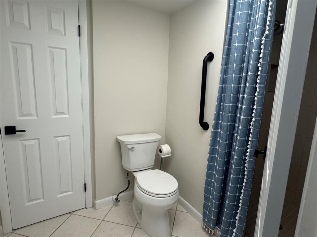 9300 Southwest 8th Street, Unit 215 Boca Raton, FL 33428 - Photo 26 of 43 a white toilet sitting next to a small bathroom