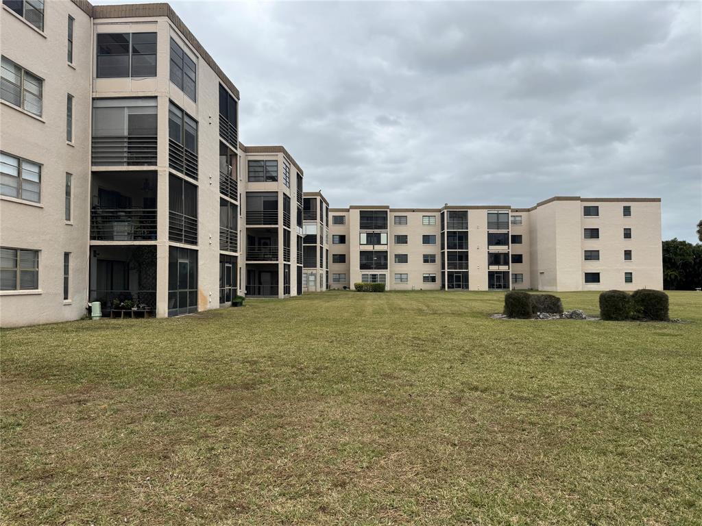 9300 Southwest 8th Street, Unit 215 Boca Raton, FL 33428 - Photo 3 of 43 a large house with a window
