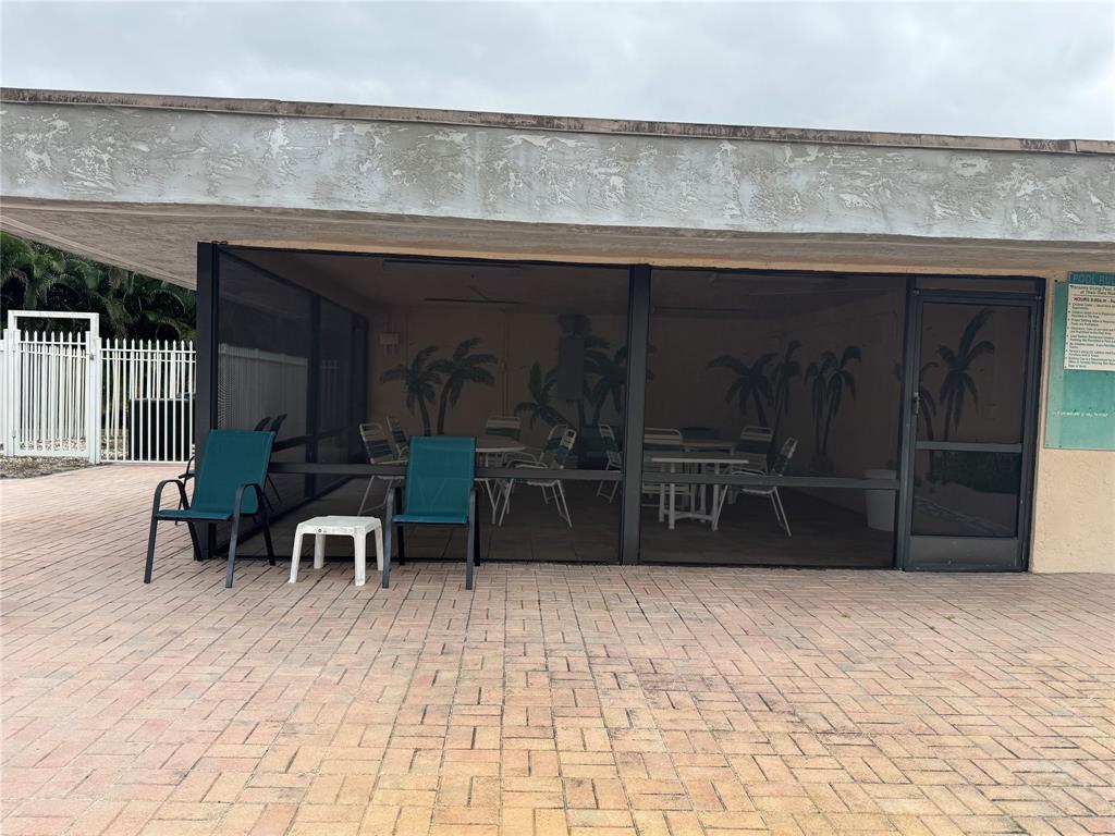 9300 Southwest 8th Street, Unit 215 Boca Raton, FL 33428 - Photo 8 of 43 SCREENED IN EATINGAREA OFF POOL