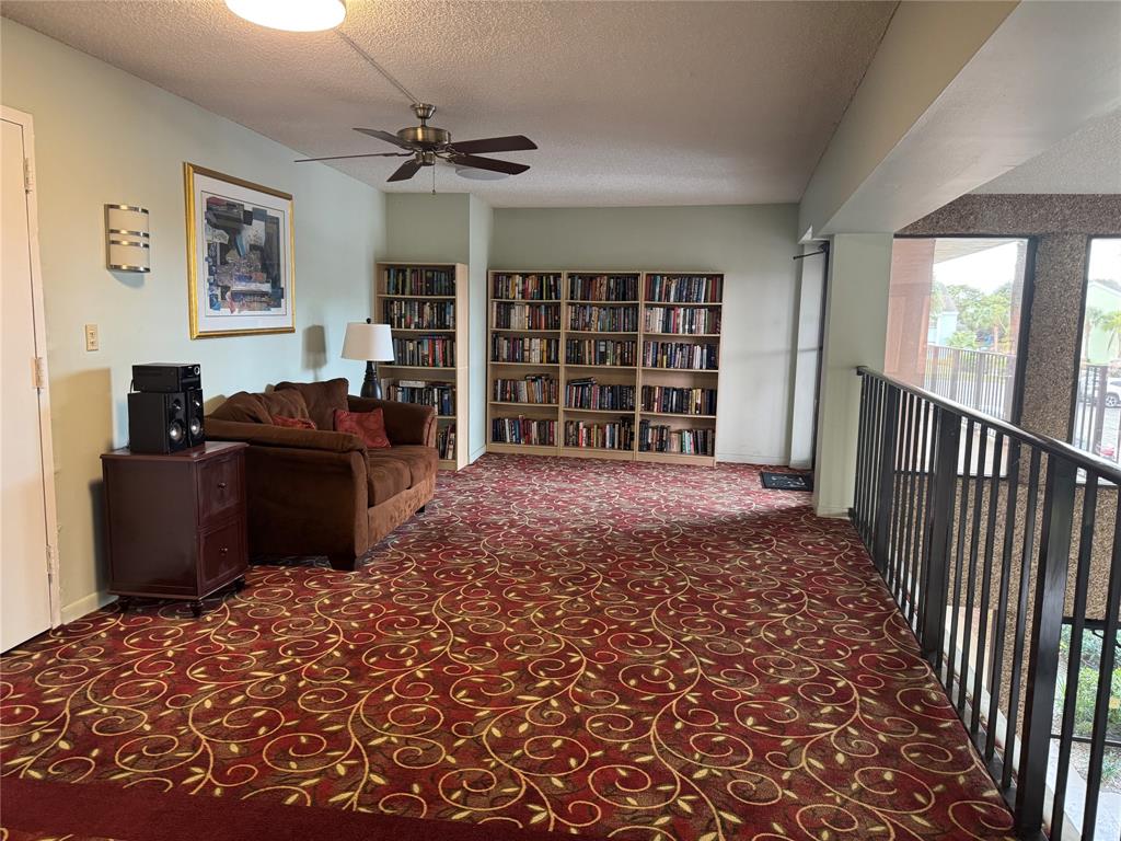 9300 Southwest 8th Street, Unit 215 Boca Raton, FL 33428 - Photo 10 of 43 a living room with furniture window and a flat screen tv