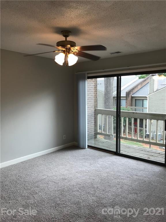 1604 Sharon Road West, Unit 22 Charlotte, NC 28210 - Photo 14 of 23 a view of an empty room with a window