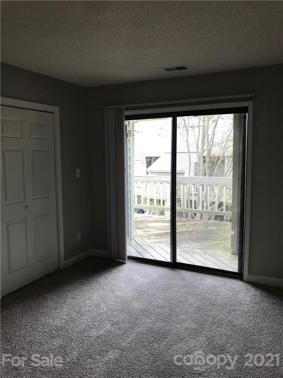 1604 Sharon Road West, Unit 22 Charlotte, NC 28210 - Photo 19 of 23 a view of a room with large windows