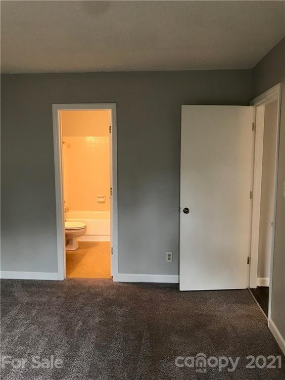 1604 Sharon Road West, Unit 22 Charlotte, NC 28210 - Photo 21 of 23 a view of an empty room with a window