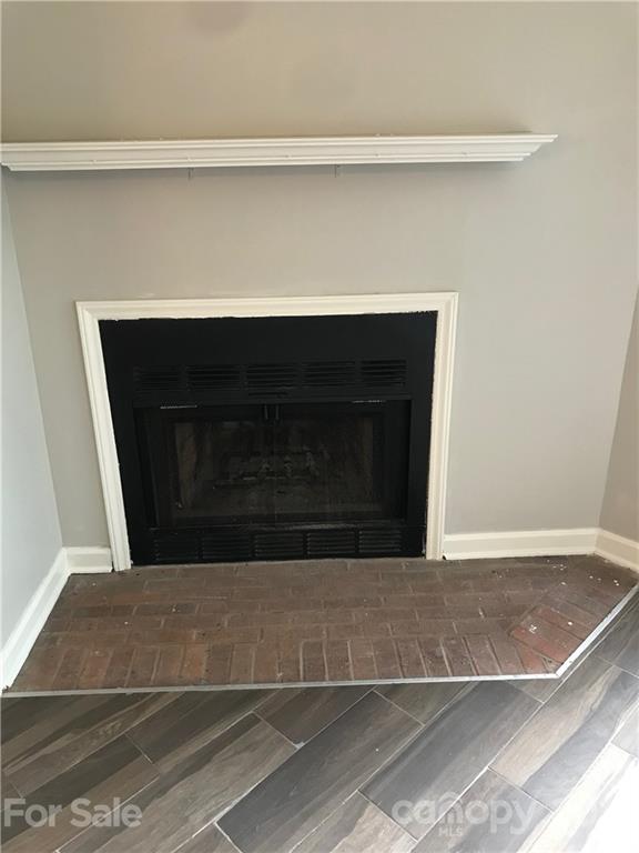 1604 Sharon Road West, Unit 22 Charlotte, NC 28210 - Photo 6 of 23 a living room with a fireplace