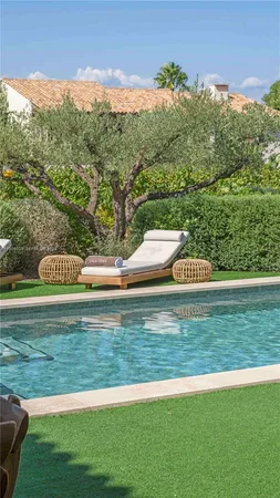 a front view of a house with lake view and mountain view