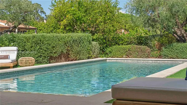 a view of a swimming pool with a garden