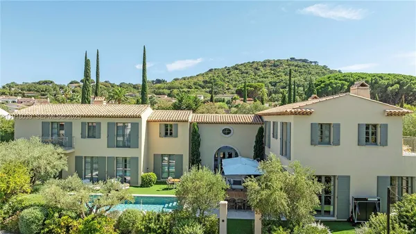 an aerial view of residential houses with outdoor space and street view