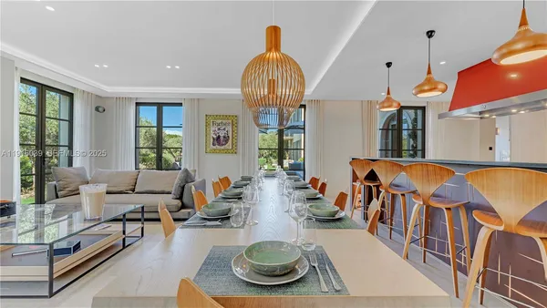 a living room with furniture and a chair