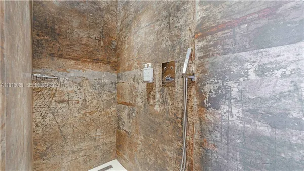 a room with gym equipment and a flat screen tv