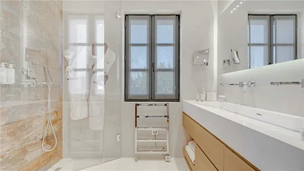 a dining room with table chairs and wooden floor