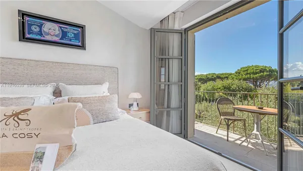 a bathroom with a sink a tub and a mirror