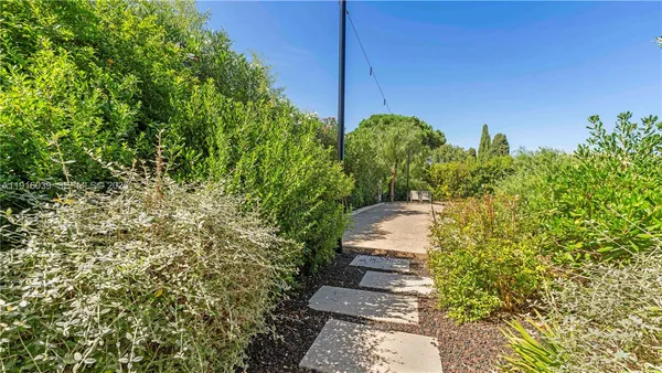 a view of a garden and basketball court