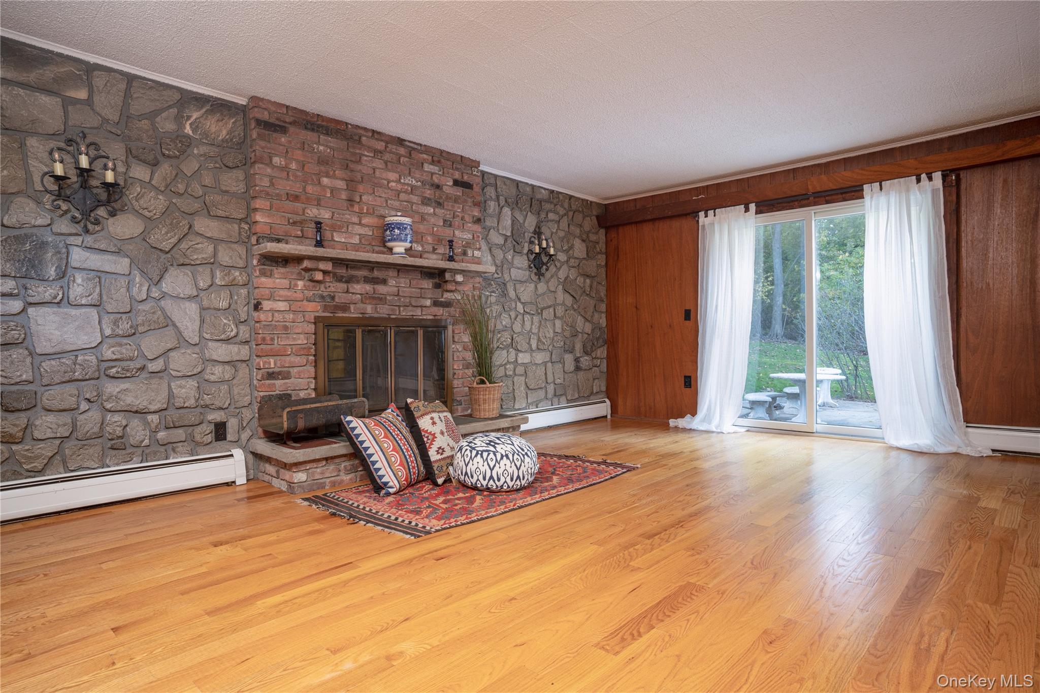 551 South Pascack Road Spring Valley, NY 10977 - Photo 12 of 31 a living room with furniture and a fireplace