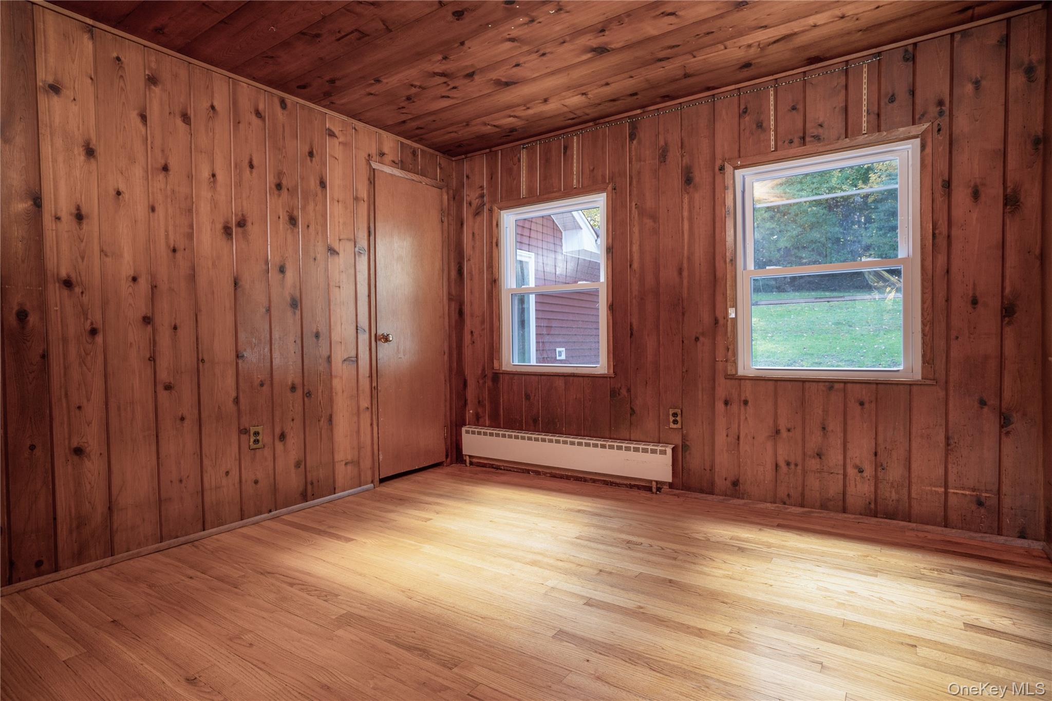 551 South Pascack Road Spring Valley, NY 10977 - Photo 24 of 31 a view of an empty room with wooden floor and windows