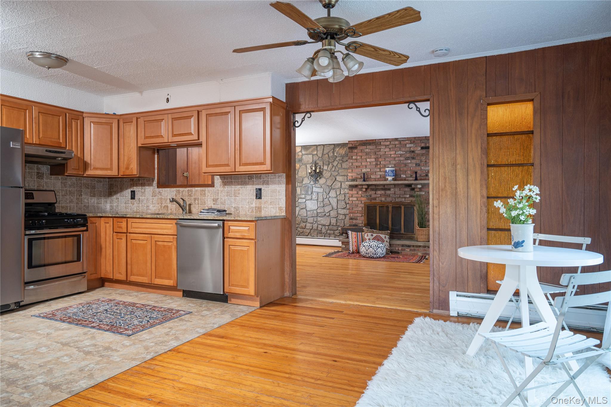 551 South Pascack Road Spring Valley, NY 10977 - Photo 9 of 31 a kitchen with a sink cabinets and wooden floor