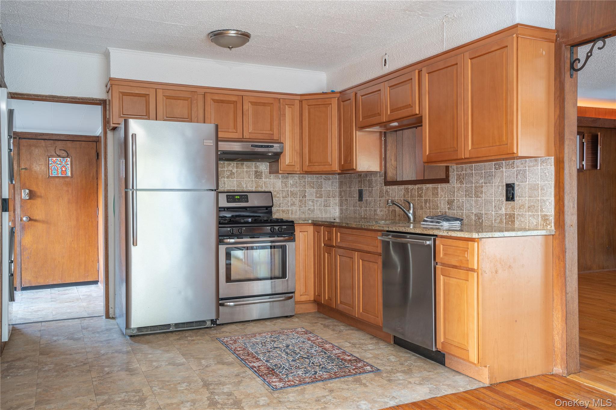 551 South Pascack Road Spring Valley, NY 10977 - Photo 10 of 31 a kitchen with stainless steel appliances granite countertop a refrigerator stove top oven and sink