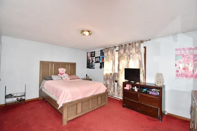 a bedroom with furniture and a bed