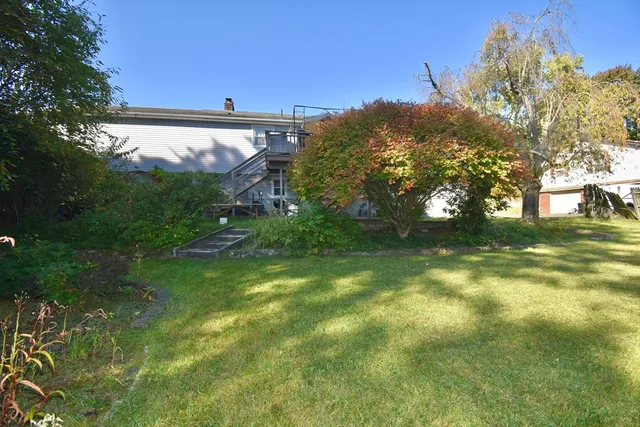 a backyard of a house with lots of green space