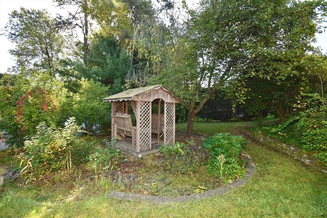 a view of a chairs and table in the balcony