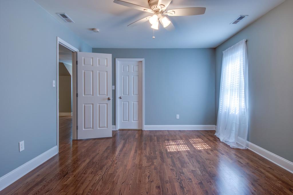 3615 Gunn Road Springfield, TN 37172 - Photo 15 of 30 an empty room with wooden floor and windows