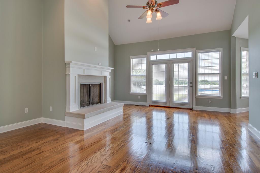 3615 Gunn Road Springfield, TN 37172 - Photo 3 of 30 wooden floor fireplace and windows in an empty room