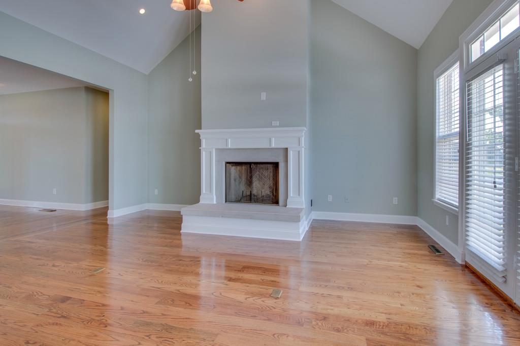 3615 Gunn Road Springfield, TN 37172 - Photo 4 of 30 a view of empty room with wooden floor and fireplace