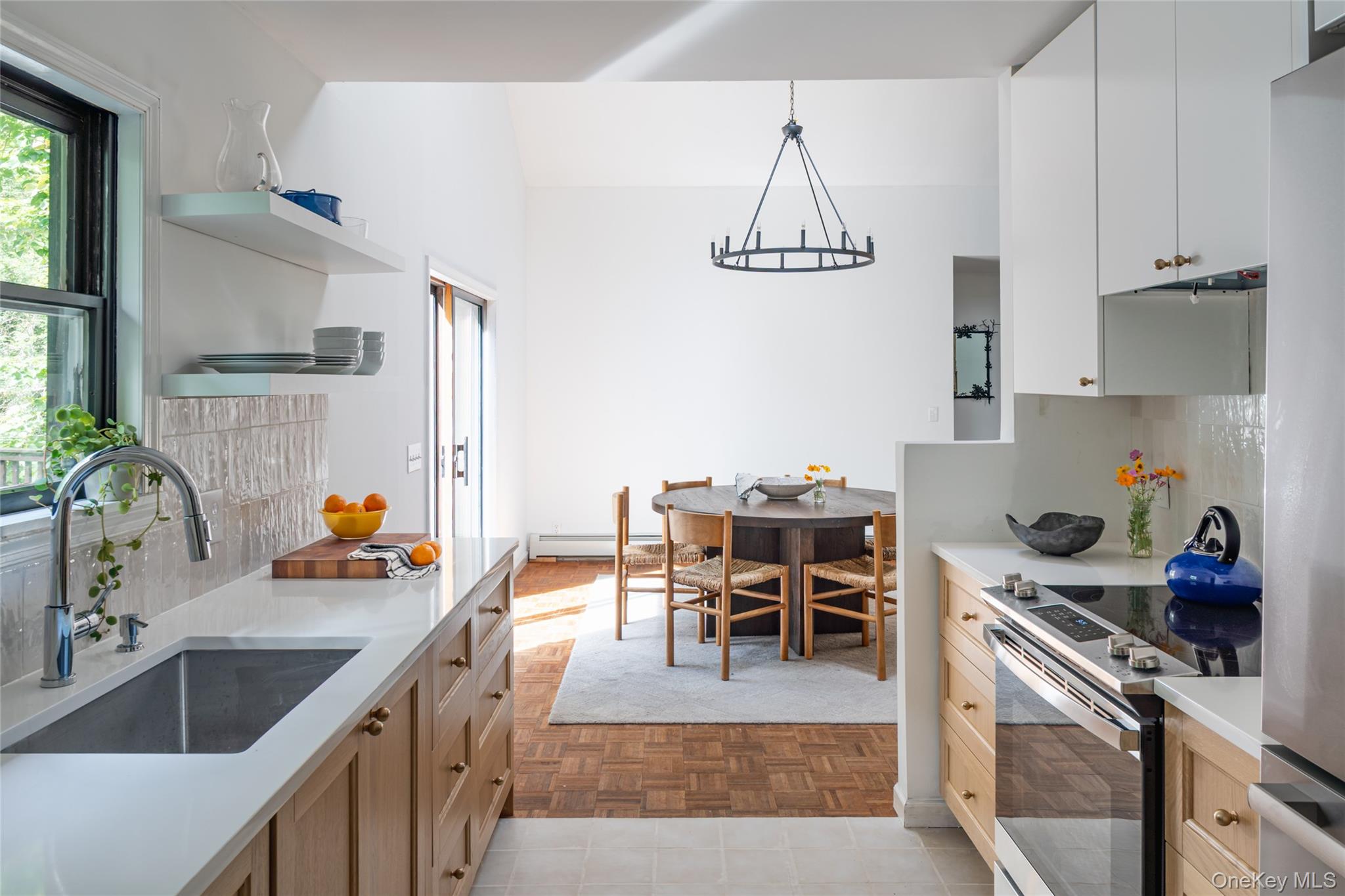 15 Deer Meadow Road Bethel, NY 12720 - Photo 16 of 41 Kitchen with backsplash, open shelves, appliances with stainless steel finishes, and plenty of natural light