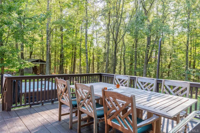 a view of a backyard with sitting area
